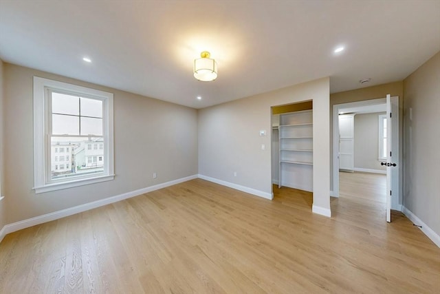 unfurnished bedroom with light wood-type flooring