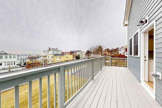 wooden deck featuring a yard