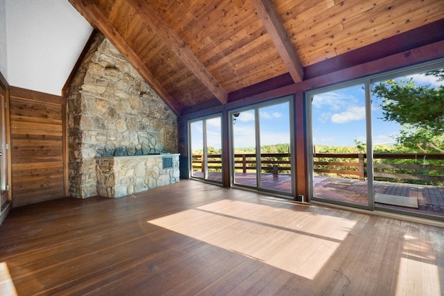 unfurnished sunroom with vaulted ceiling with beams and wooden ceiling