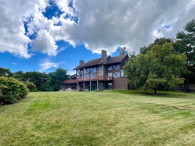 rear view of house with a yard