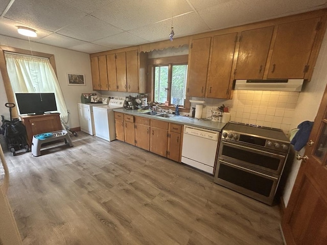 36 Edwards St, Quincy, MA 02169 - kitchen with white dishwasher, extractor fan, double oven range, a sink, and washing machine and dryer