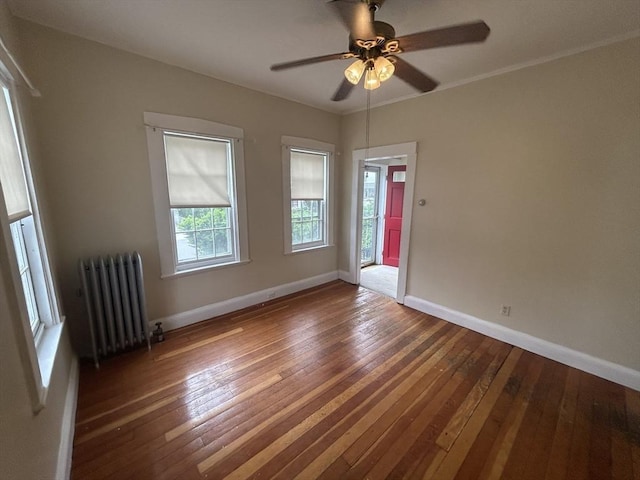 36 Edwards St, Quincy, MA 02169 - unfurnished room featuring radiator heating unit, hardwood / wood-style floors, baseboards, and a ceiling fan