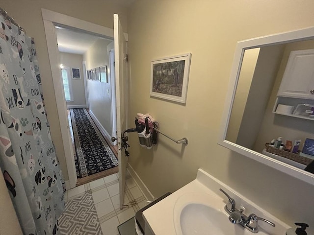 36 Edwards St, Quincy, MA 02169 - full bath featuring vanity, tile patterned floors, baseboards, and a shower with shower curtain
