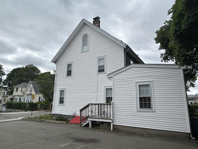 36 Edwards St, Quincy, MA 02169 - view of property exterior with a chimney