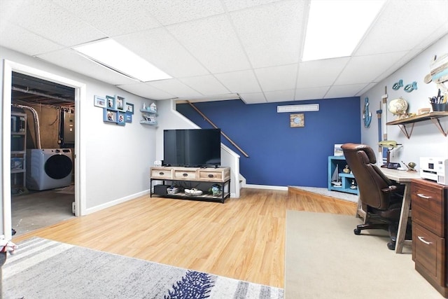 78 Yorktown Ct Unit 78, Chicopee, MA 01020 - home office with washer / clothes dryer, a drop ceiling, wood finished floors, electric panel, and baseboards