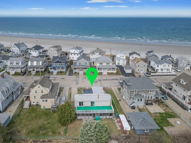 aerial perspective of suburban area featuring expansive beach