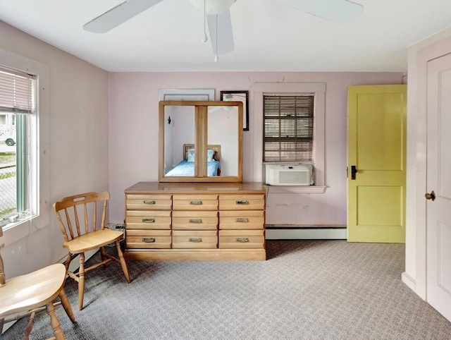 living area featuring cooling unit, a baseboard heating unit, a ceiling fan, and carpet floors