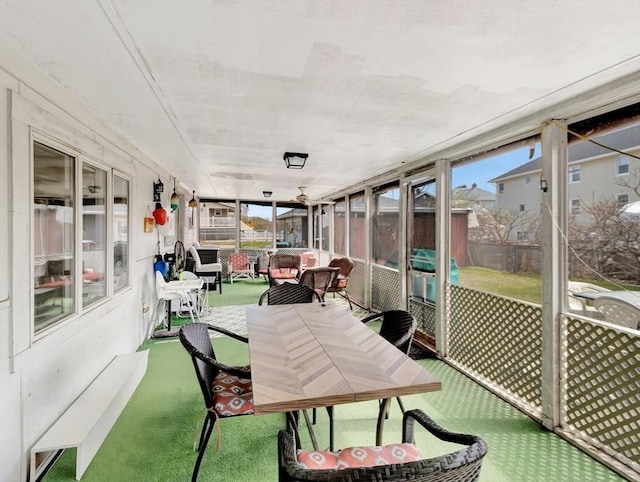 sunroom / solarium with outdoor dining area