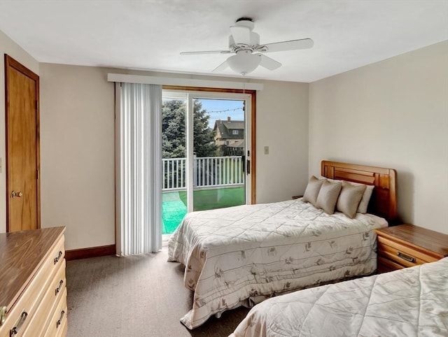 bedroom featuring access to outside, carpet flooring, baseboards, and a ceiling fan