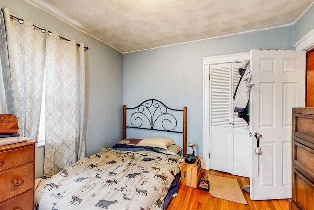 bedroom featuring a closet and light wood-type flooring
