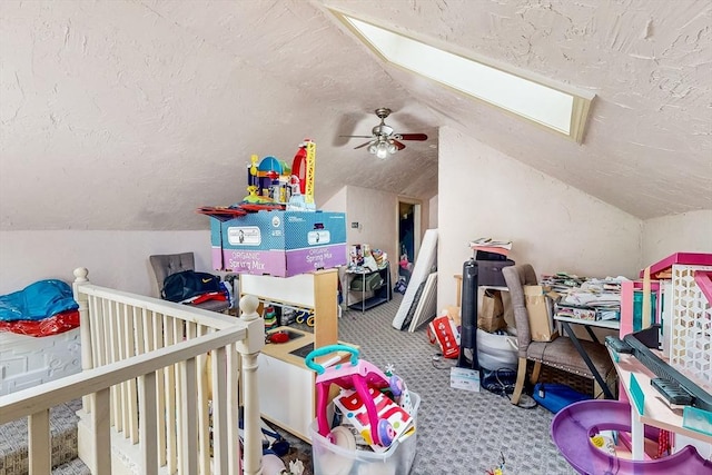 bedroom featuring carpet floors, a textured ceiling, and lofted ceiling with skylight