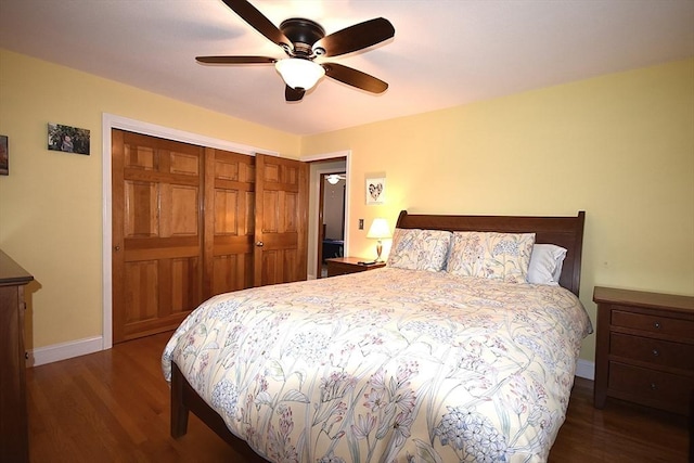 bedroom with wood finished floors, a closet, baseboards, and ceiling fan