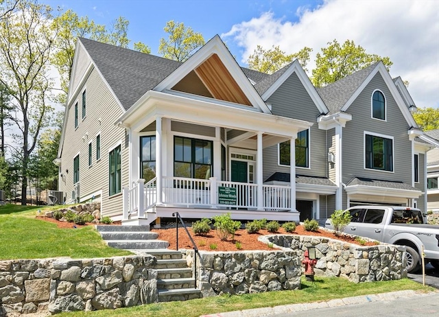 view of front of home with a garage and covered porch