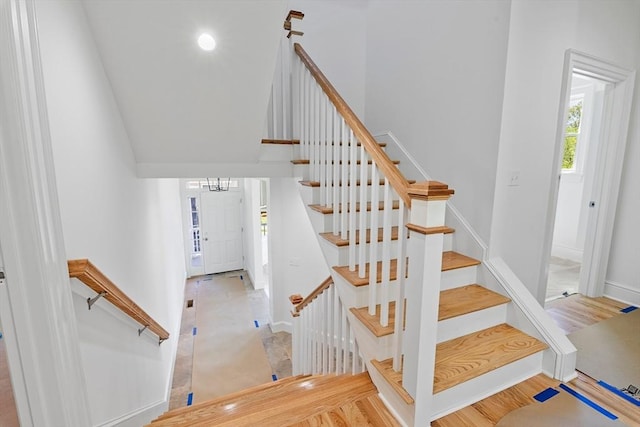 stairs with hardwood / wood-style floors