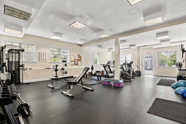 workout area featuring a wall unit AC