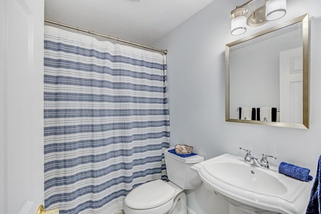 24 Emerald Ln, Falmouth, MA 02536 - bathroom with toilet and curtained shower