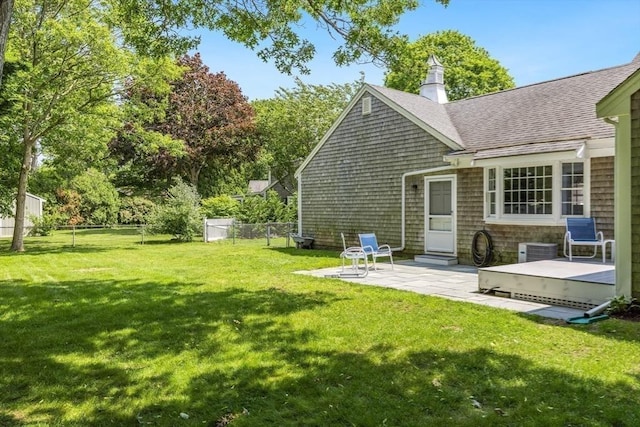 24 Emerald Ln, Falmouth, MA 02536 - rear view of property with a shingled roof, a patio area, and a chimney