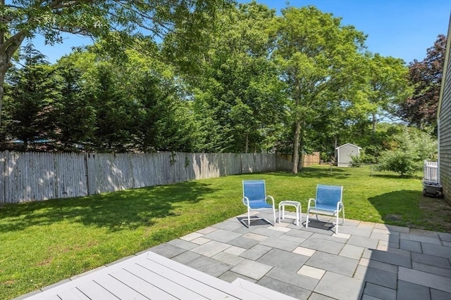 24 Emerald Ln, Falmouth, MA 02536 - fenced backyard featuring a patio area