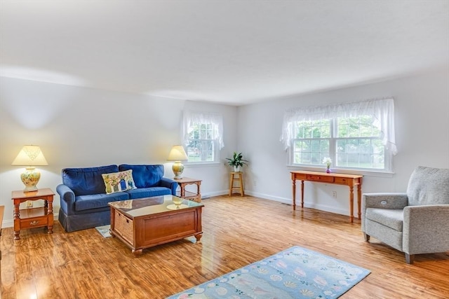 24 Emerald Ln, Falmouth, MA 02536 - living room featuring light wood-style floors and baseboards
