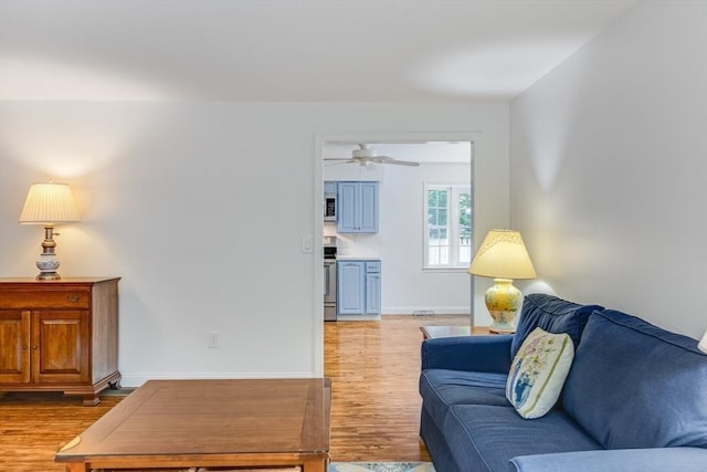 24 Emerald Ln, Falmouth, MA 02536 - living room featuring light wood finished floors and a ceiling fan