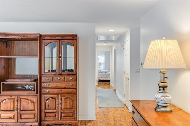 24 Emerald Ln, Falmouth, MA 02536 - corridor featuring light wood-type flooring and attic access
