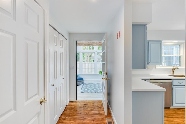 24 Emerald Ln, Falmouth, MA 02536 - hallway with light wood-style flooring and a sink