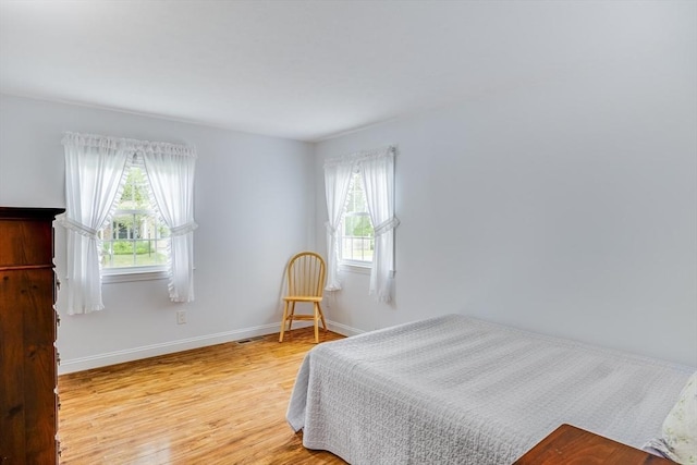 24 Emerald Ln, Falmouth, MA 02536 - bedroom featuring wood finished floors and baseboards