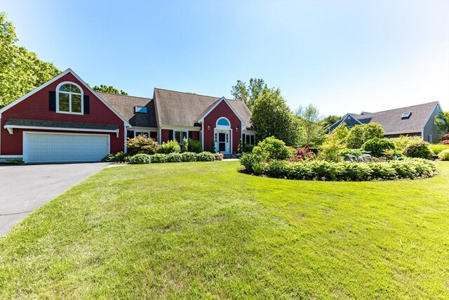 11 Polaris Dr, Mashpee, MA 02649 - view of front of home featuring concrete driveway and a front yard