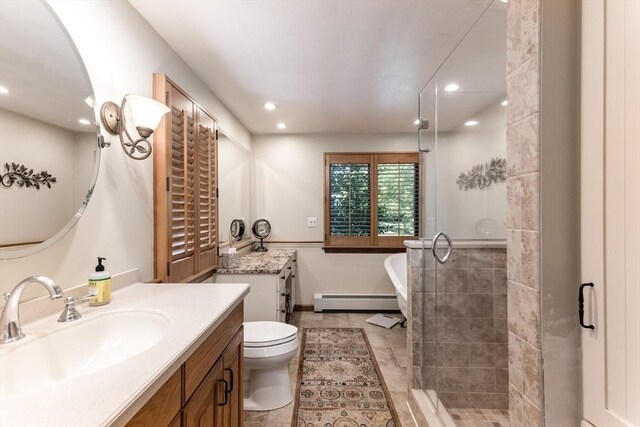 11 Polaris Dr, Mashpee, MA 02649 - full bath with a shower stall, a wainscoted wall, a freestanding bath, and baseboard heating