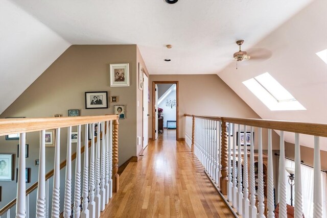11 Polaris Dr, Mashpee, MA 02649 - hall with light wood-style flooring and vaulted ceiling with skylight