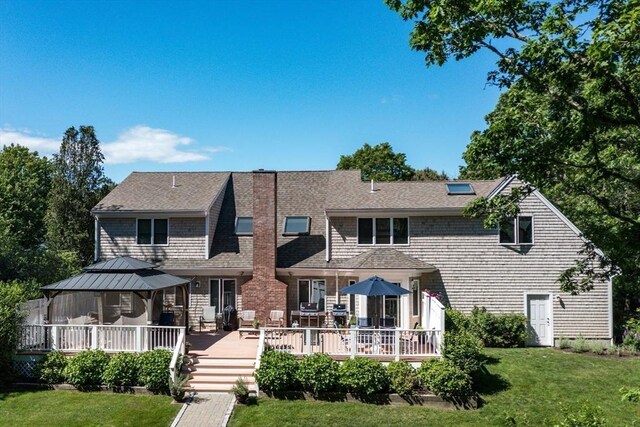 11 Polaris Dr, Mashpee, MA 02649 - rear view of house featuring a gazebo, a yard, a shingled roof, and a wooden deck