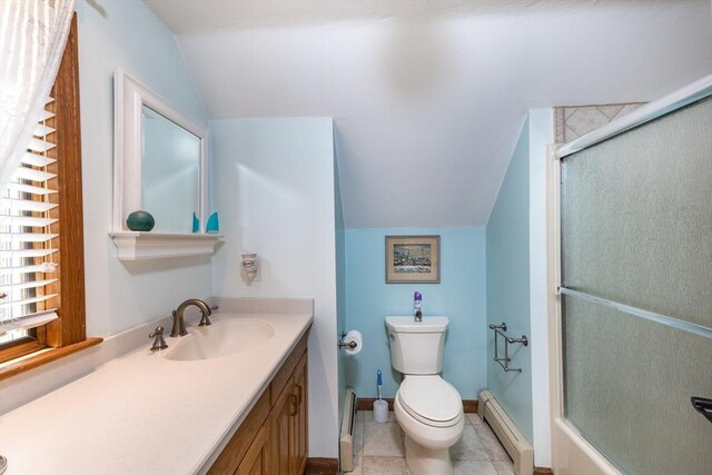 11 Polaris Dr, Mashpee, MA 02649 - bathroom with a shower stall, vanity, toilet, vaulted ceiling, and baseboard heating