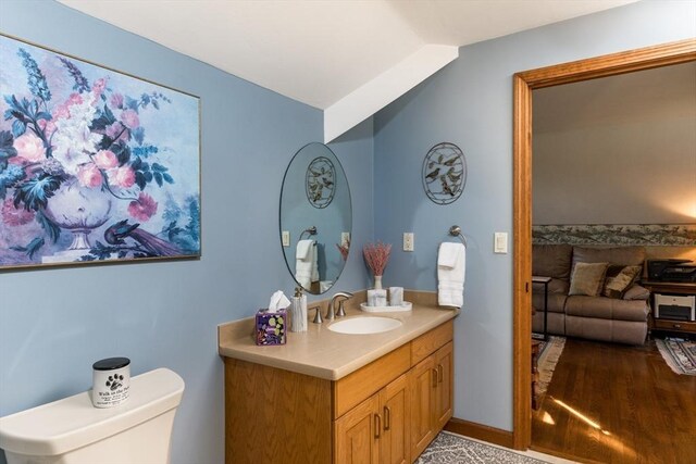 11 Polaris Dr, Mashpee, MA 02649 - half bath with toilet, vanity, and vaulted ceiling
