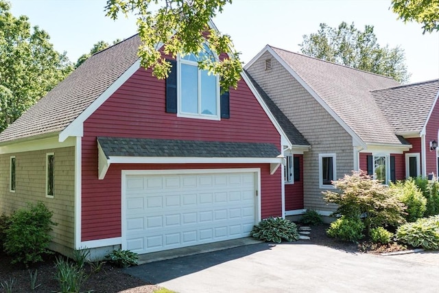 11 Polaris Dr, Mashpee, MA 02649 - craftsman inspired home with a garage and aphalt driveway