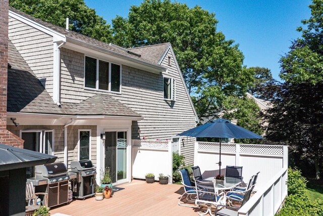 11 Polaris Dr, Mashpee, MA 02649 - wooden terrace featuring fence, outdoor dining space, and a grill
