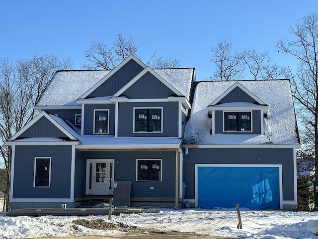 view of front of house with board and batten siding and an attached garage