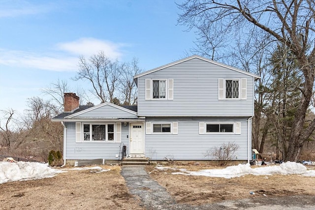 view of front of property featuring a chimney