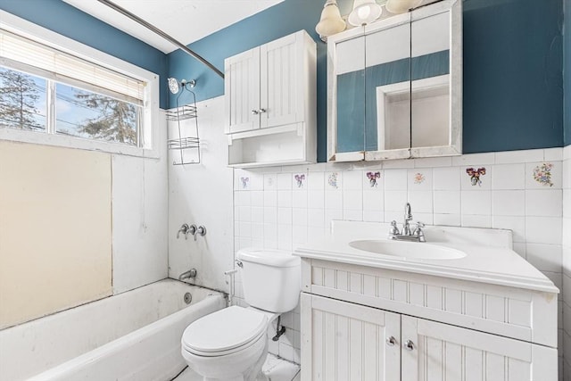 bathroom featuring toilet, shower / bath combination, vanity, and tile walls