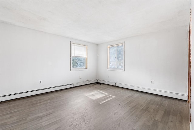 spare room featuring wood finished floors