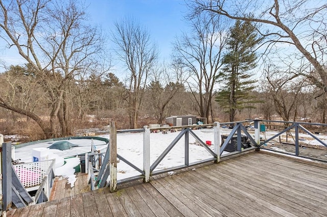 deck with a storage shed and an outdoor structure