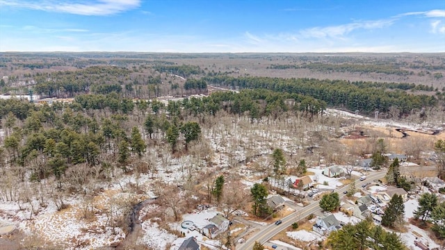 birds eye view of property with a view of trees