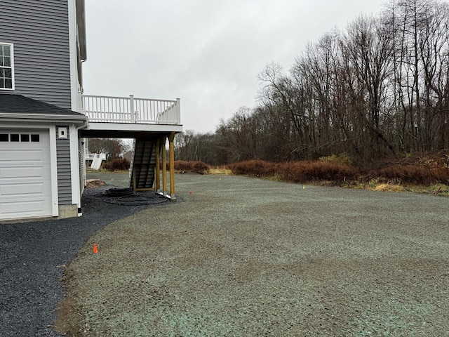 view of yard with a deck and stairway