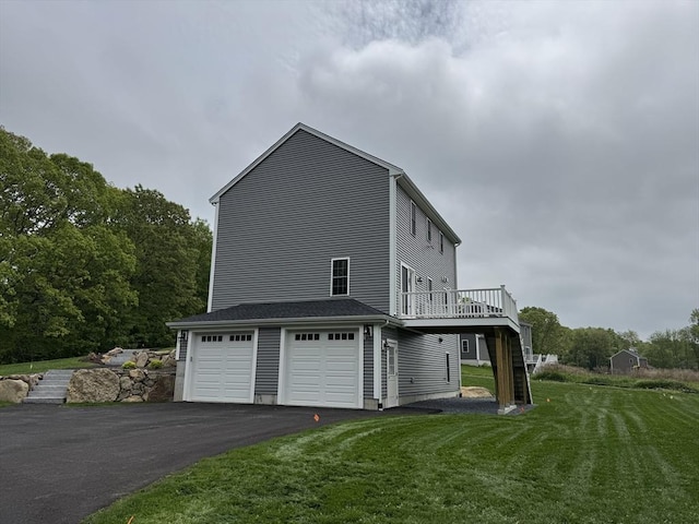 200 Pine St, Rehoboth, MA 02769 - view of property exterior featuring driveway, a yard, an attached garage, and a wooden deck