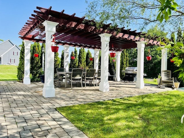 view of patio featuring outdoor dining space, grilling area, and a pergola