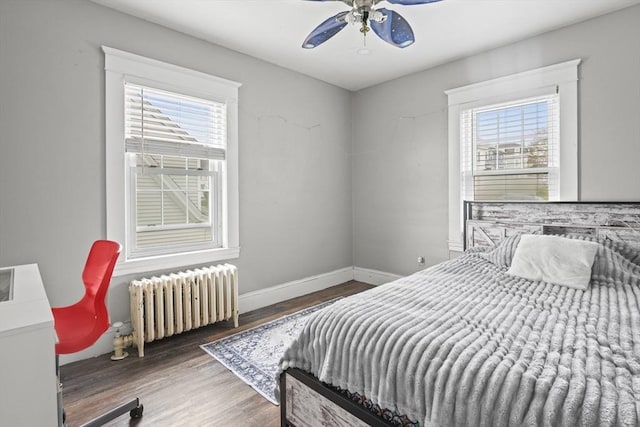 21 Vernon St, Lowell, MA 01850 - bedroom with a ceiling fan, baseboards, wood finished floors, and radiator
