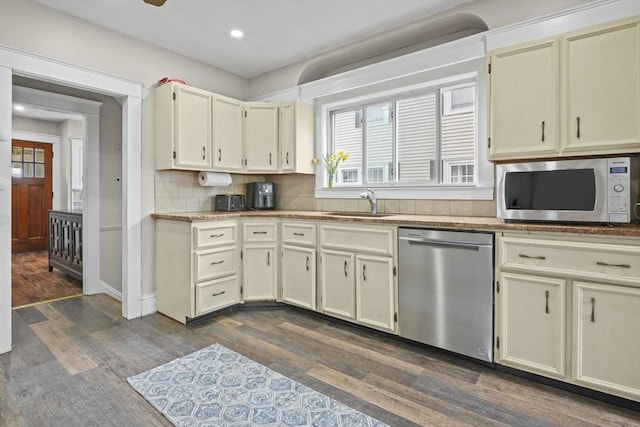 21 Vernon St, Lowell, MA 01850 - kitchen with dishwasher, a sink, dark wood-type flooring, and white microwave