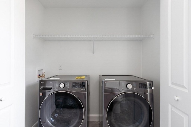 clothes washing area featuring washing machine and dryer