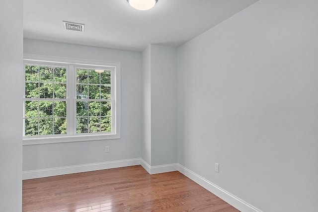 empty room with light hardwood / wood-style floors