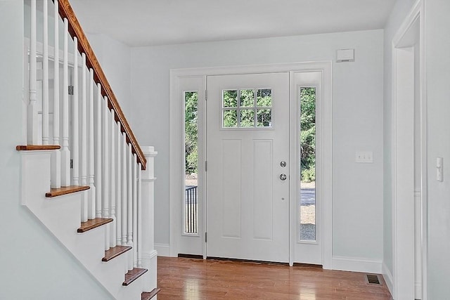 entryway with hardwood / wood-style flooring