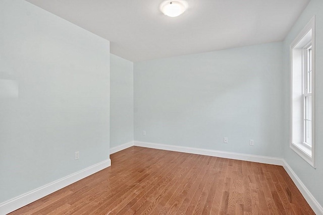 spare room featuring hardwood / wood-style floors